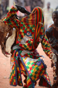 Egungun - African man wearing an elaborate costume